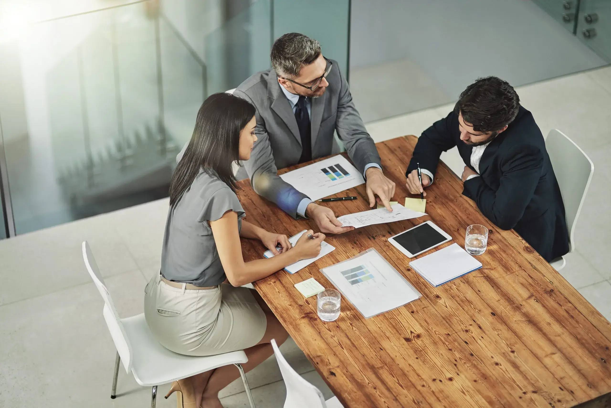 Professionals discussing business registration strategies at a conference table